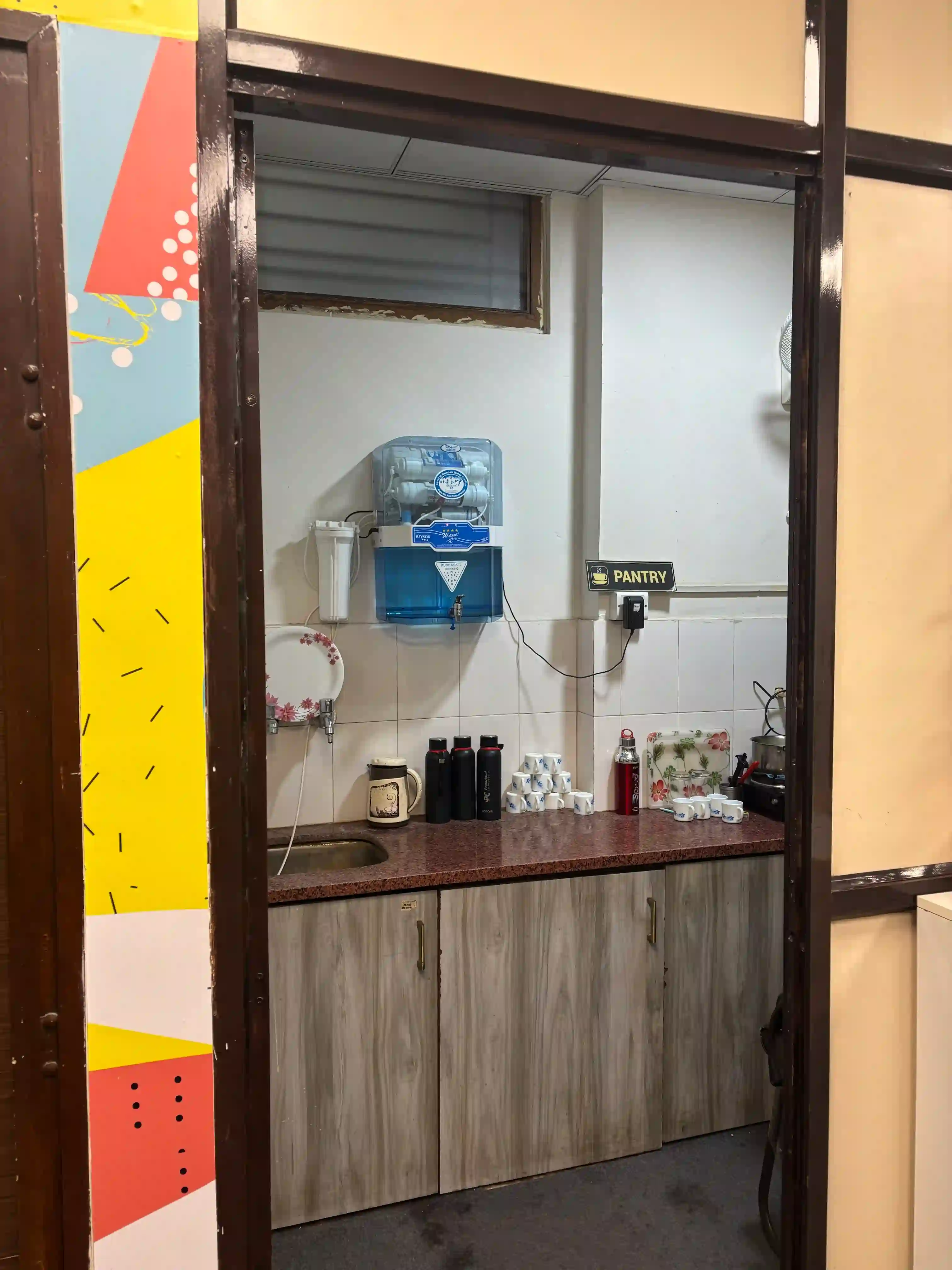Pantry and coffee counter at WorkNest coworking space